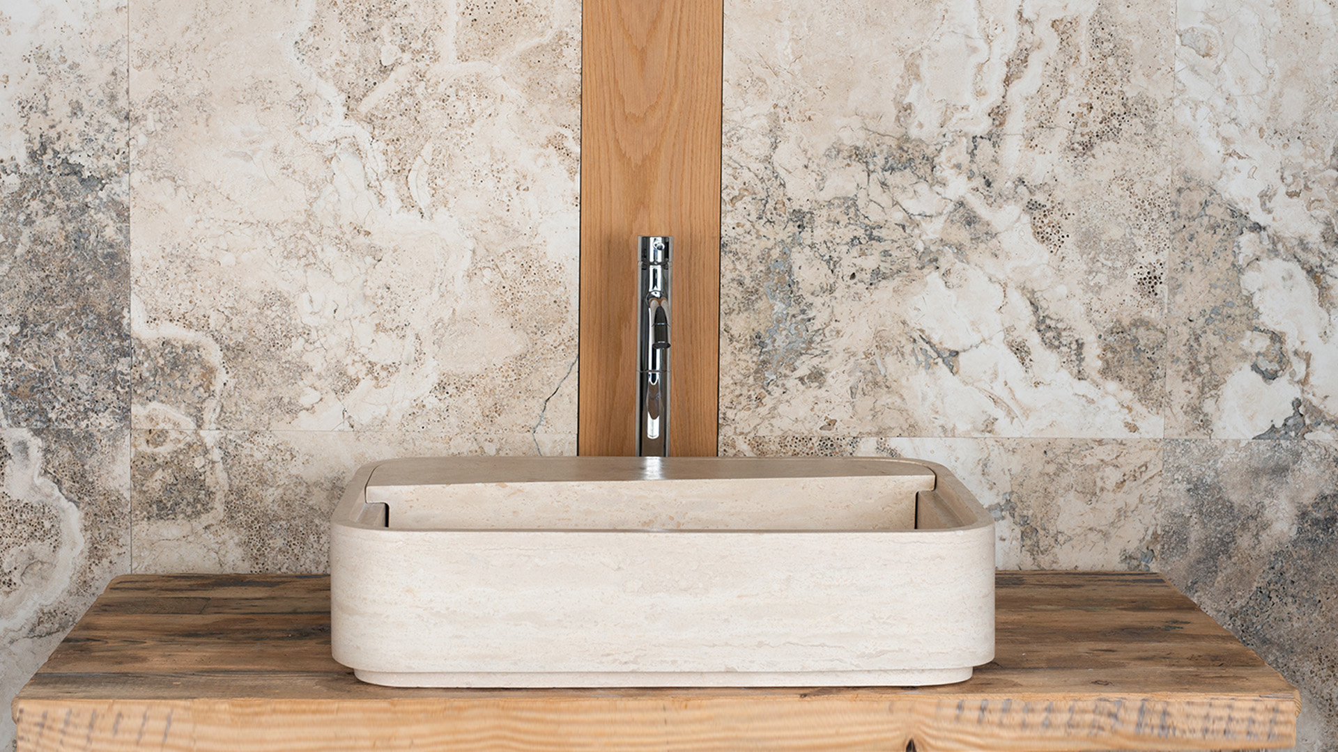 Designer travertine washbasin “Loaded”