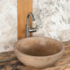 Round travertine washbasin "Ball Scuro"