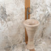 Freestanding travertine washbasin “Calice”