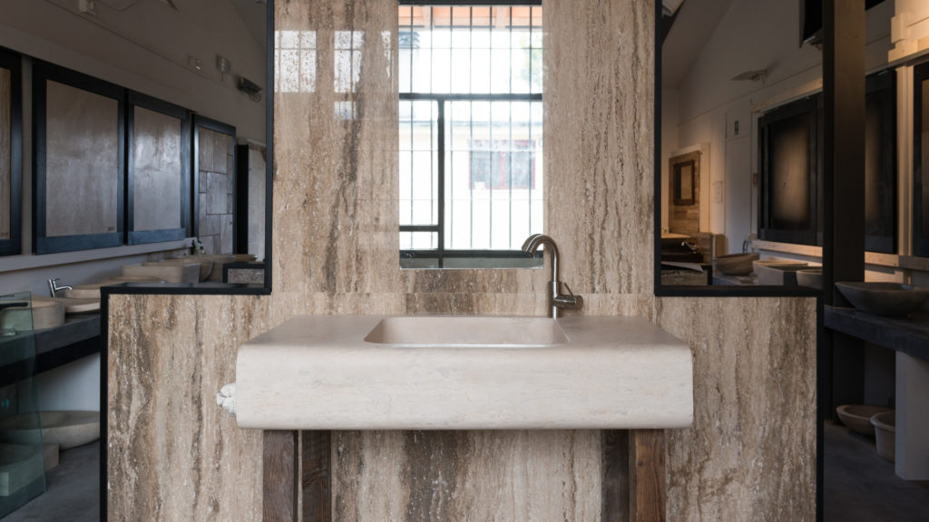 Designer travertine washbasin "Cave"