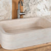 Rounded travertine washbasin "Farm B CH"