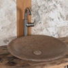 Round dark travertine washbasin “Fonterutoli SC”