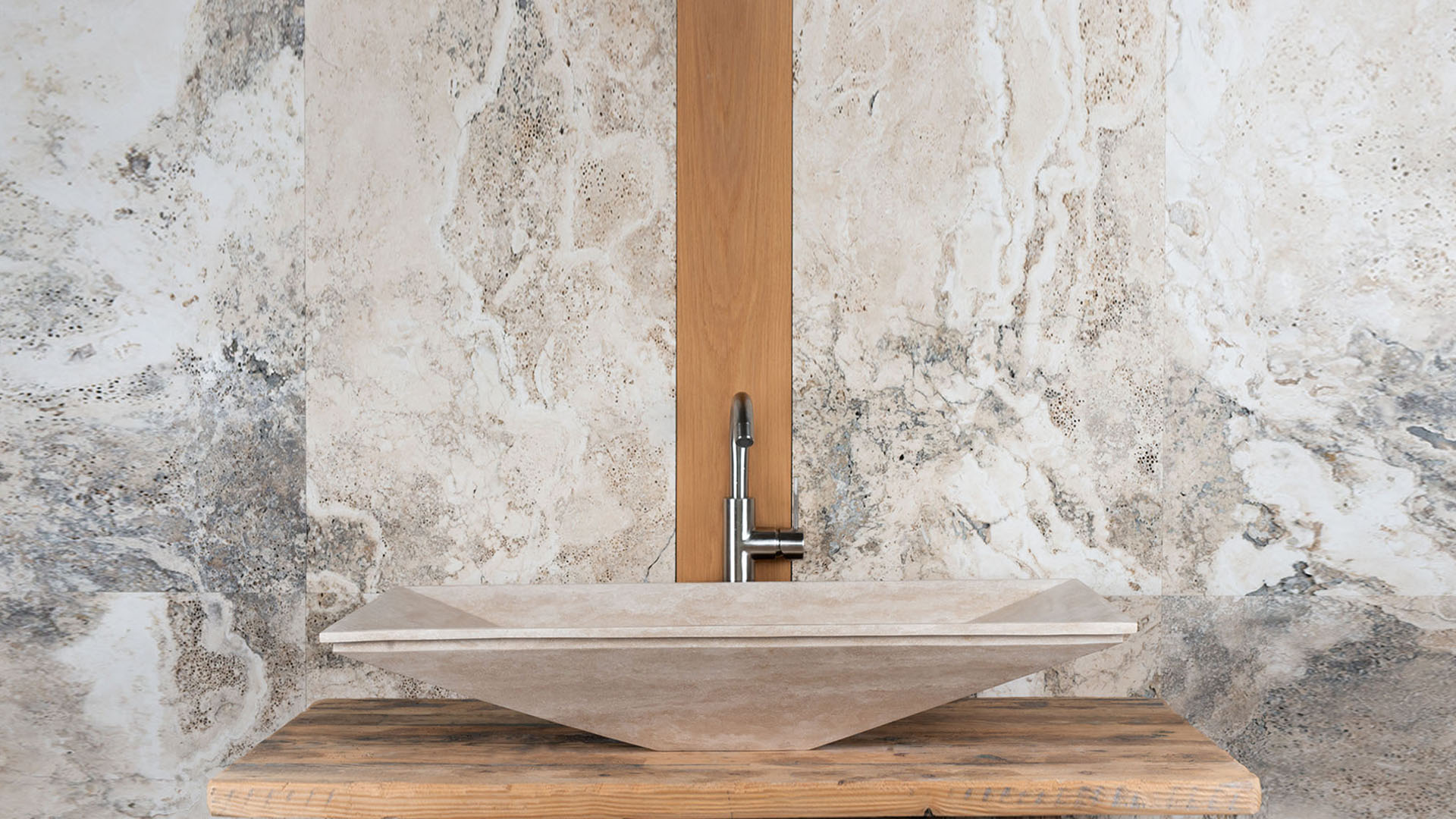 Recessed travertine washbasin “Greve”