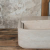 Designer travertine washbasin "Loaded"