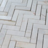 Mosaic in "Bianco Alba" marble “Spina Piccola ” Honed