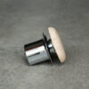 Light travertine drain stopper side