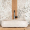 Sink "bulging" in light travertine "Concept CH"