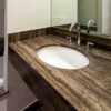 Top lavabo in travertino nero su misura